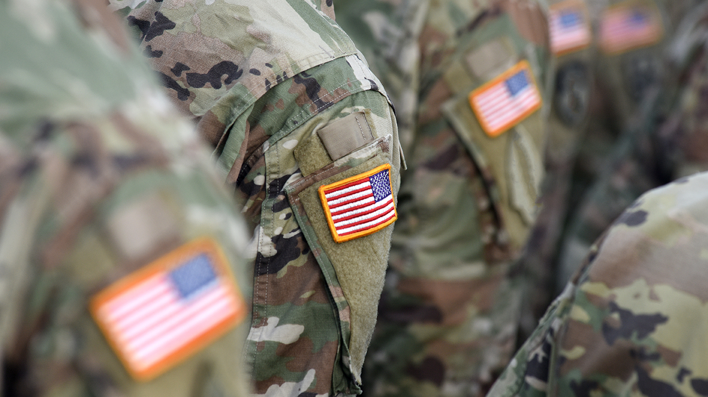 American Soldiers and Flag of USA on soldiers arm.
