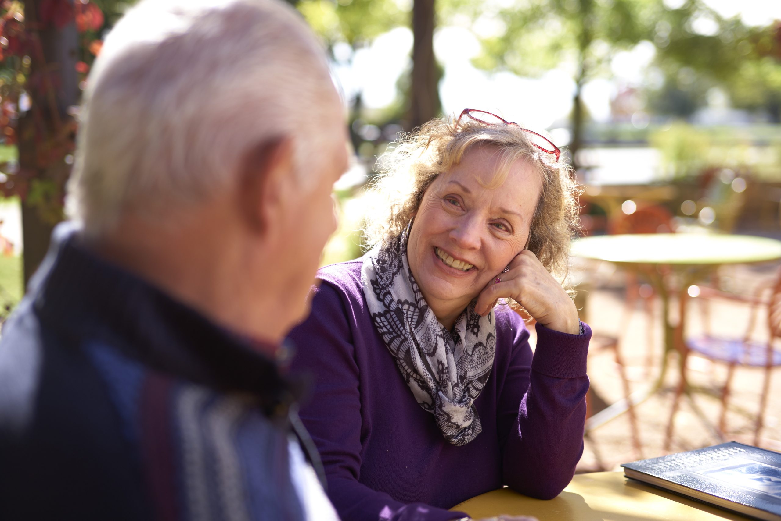 Senior couple laughing outside