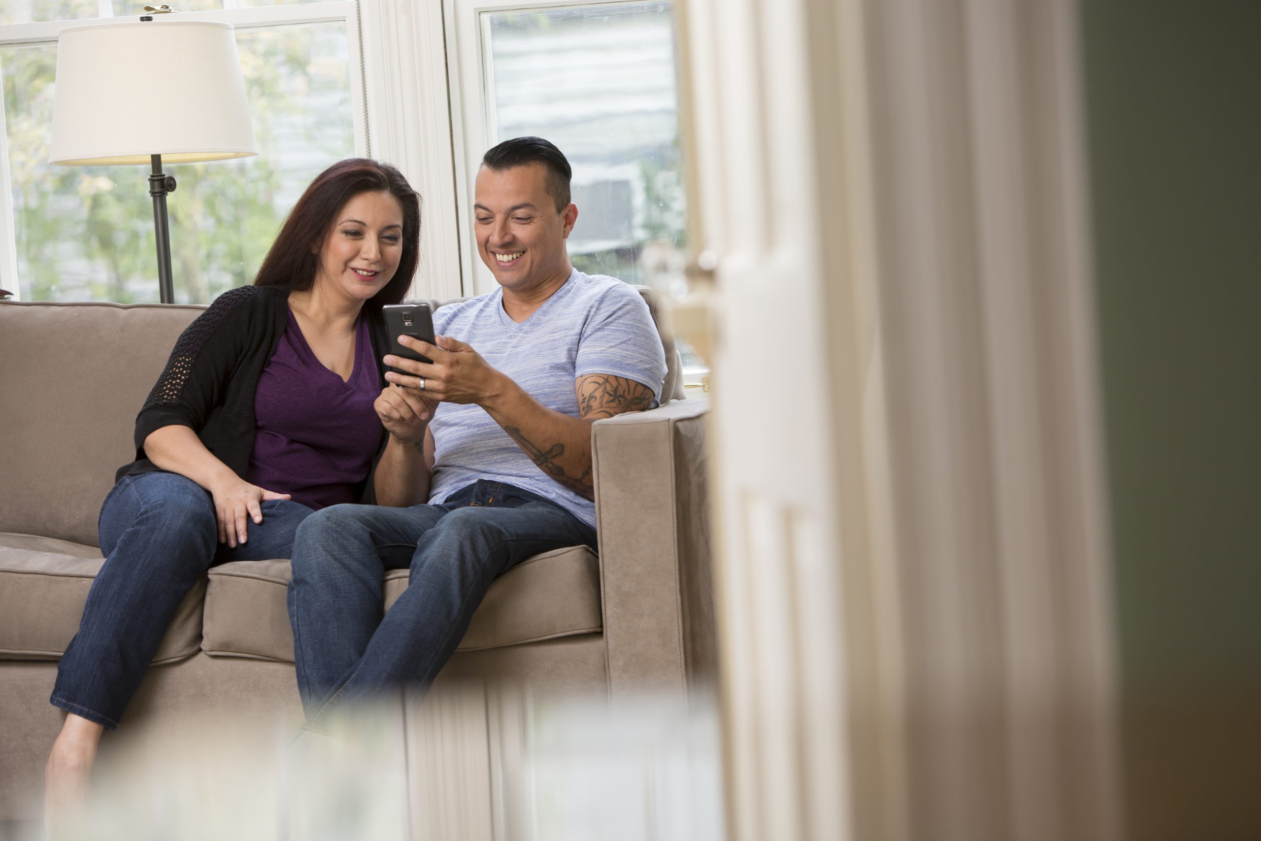 couple reviewing phone