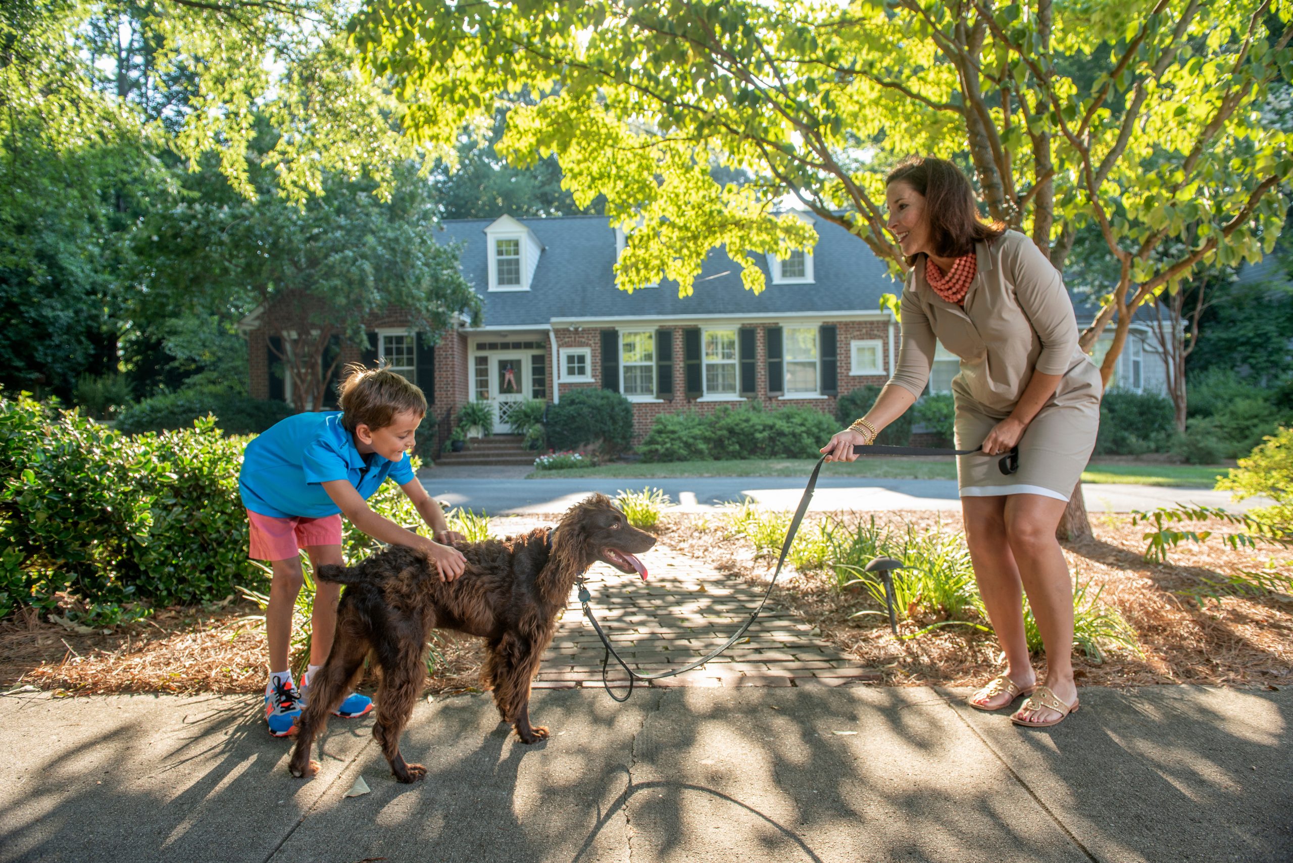Teammate and family walking dog