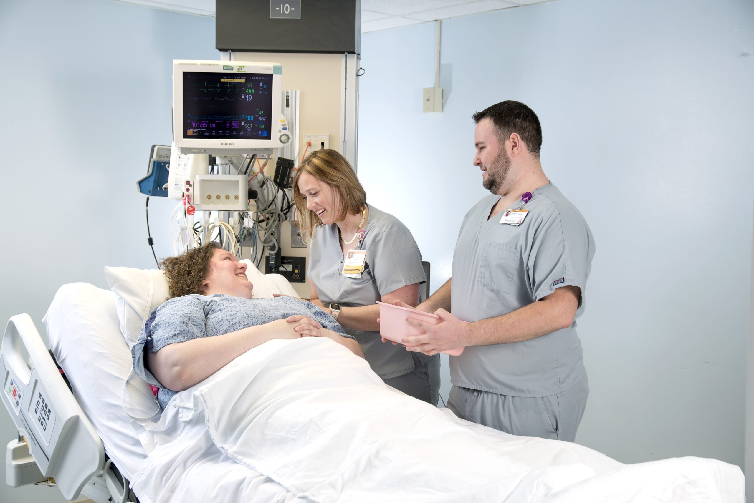 Nursing Assistants with patient.
