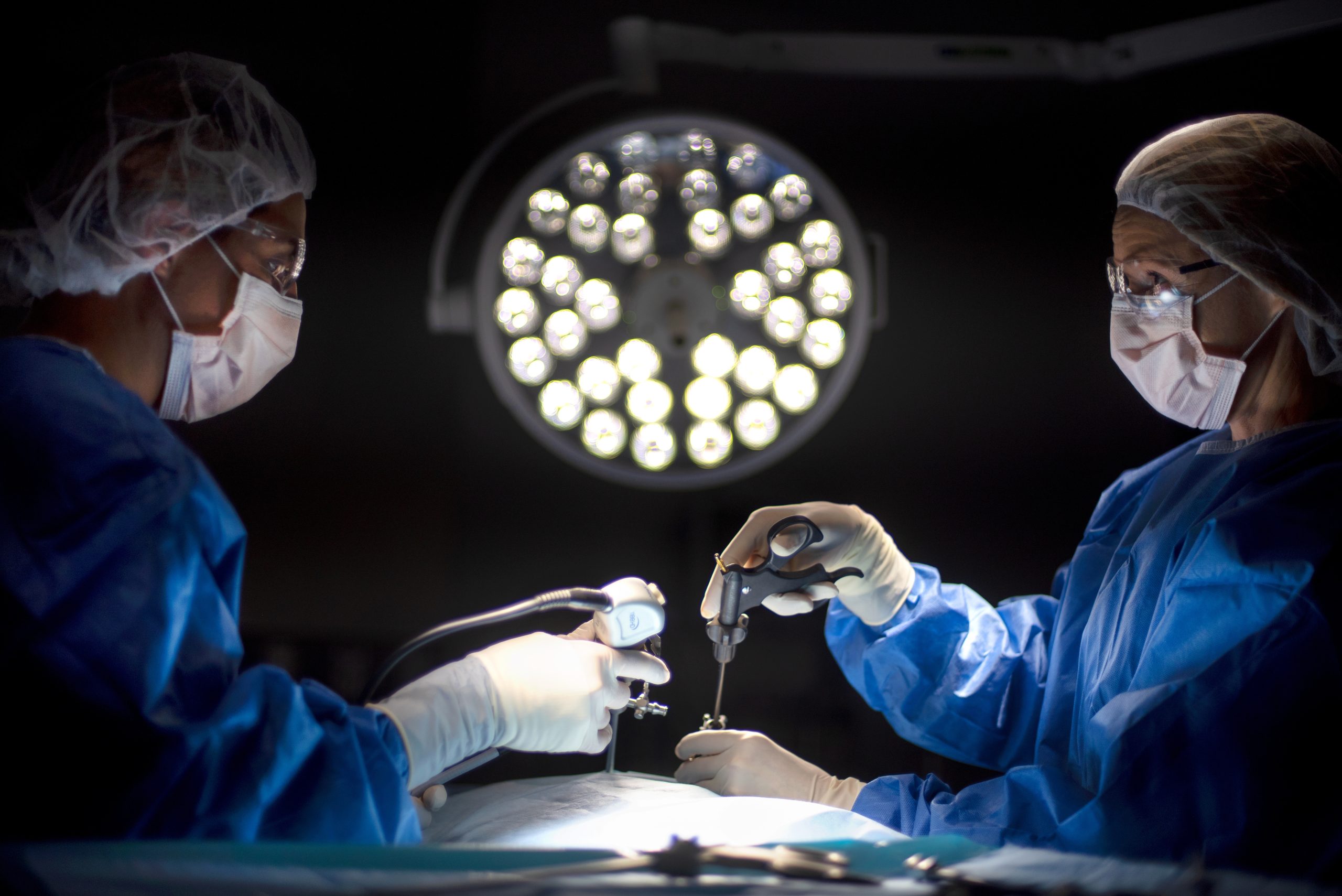 Two teammates working in operating room
