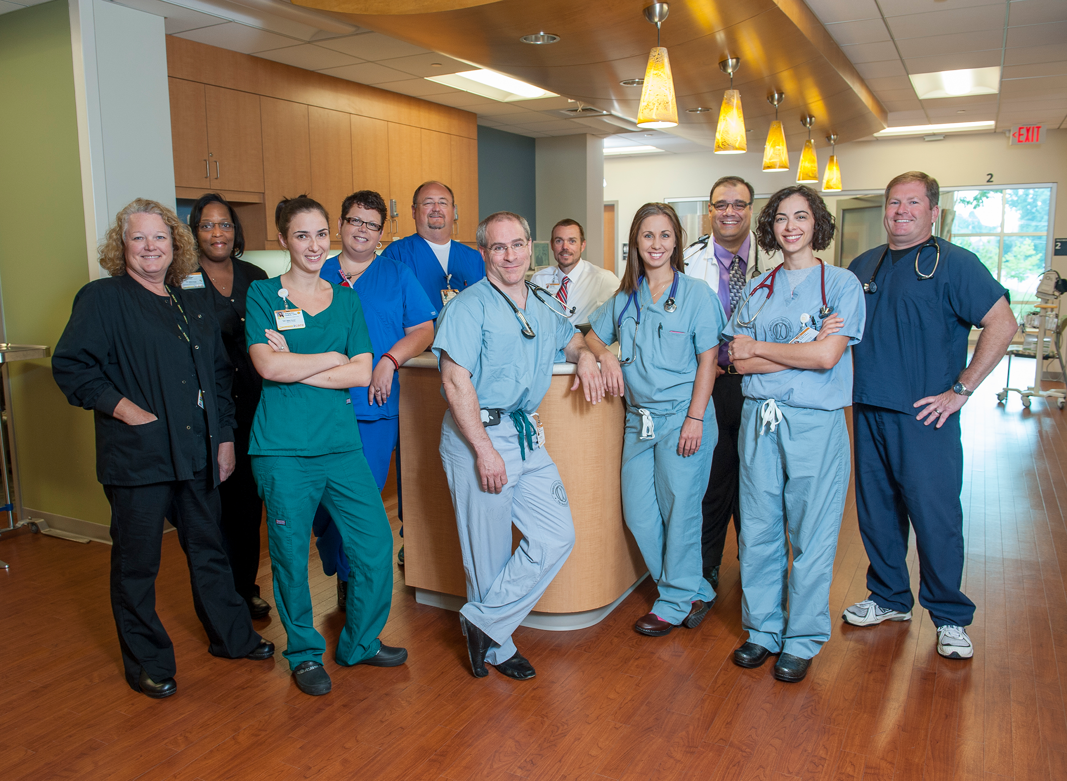 Group of clinical staff members looking at the camera smiling