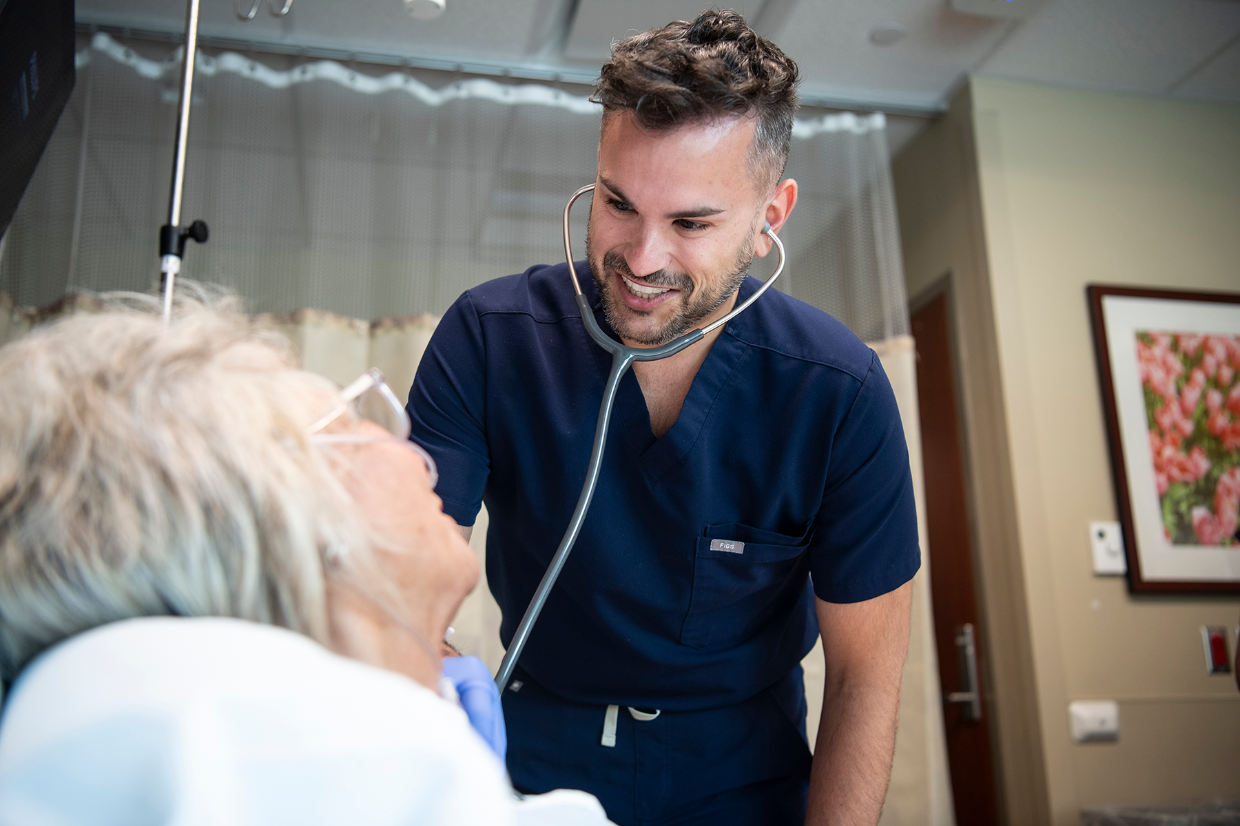 nurse interacting with patient in hospital setting